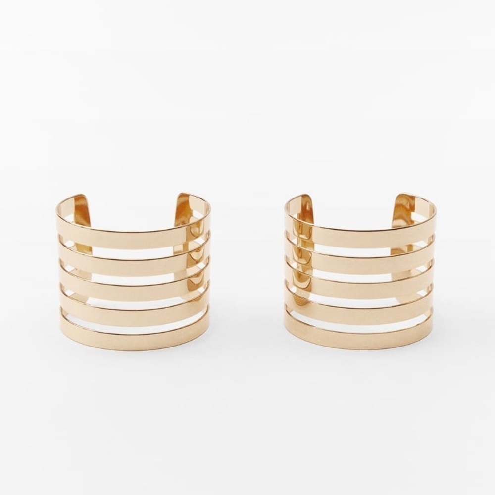 NWT. Zara Golden Pack of Two Metal Rigid Striped Armbands.